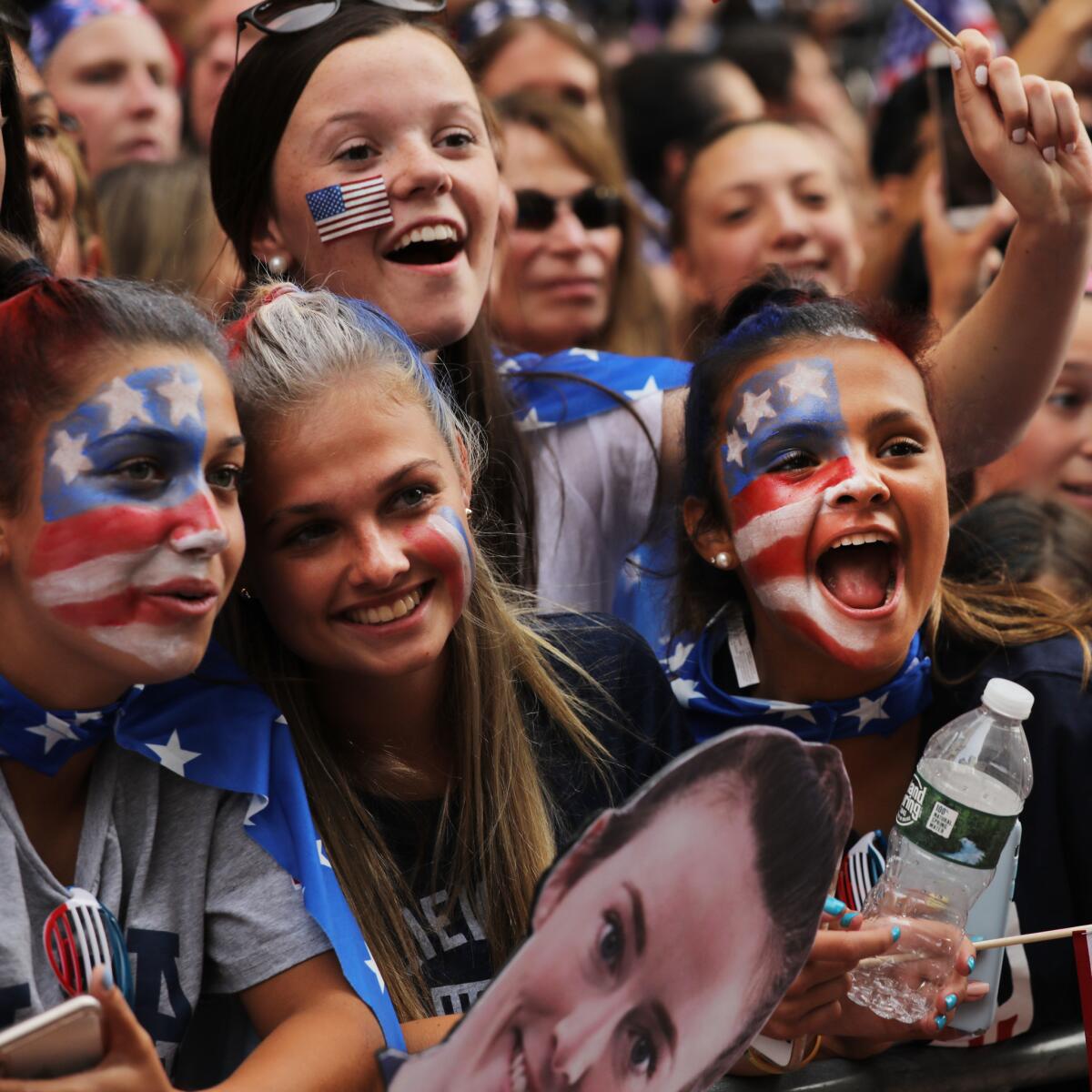 People cheer as members of the U.S. women's national soccer team travel down the Canyon of Heroes in New York.