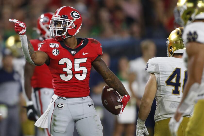 Georgia running back Brian Herrien (35) celebrates after getting a first down in the second half against Notre Dame during an NCAA college football game Saturday, Sept. 21, 2019, in Athens, Ga. (Joshua L. Jones/Athens Banner-Herald via AP)