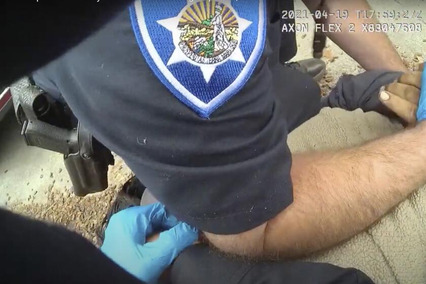 In this image taken from Alameda Police Department body camera video, Alameda Police Department officers pin 26-year-old Mario Gonzalez to the ground during an arrest, April 19, 2021, in Alameda, Calif. Gonzalez stopped breathing during the arrest and was pronounced dead at a hospital. (Alameda Police Department via AP)