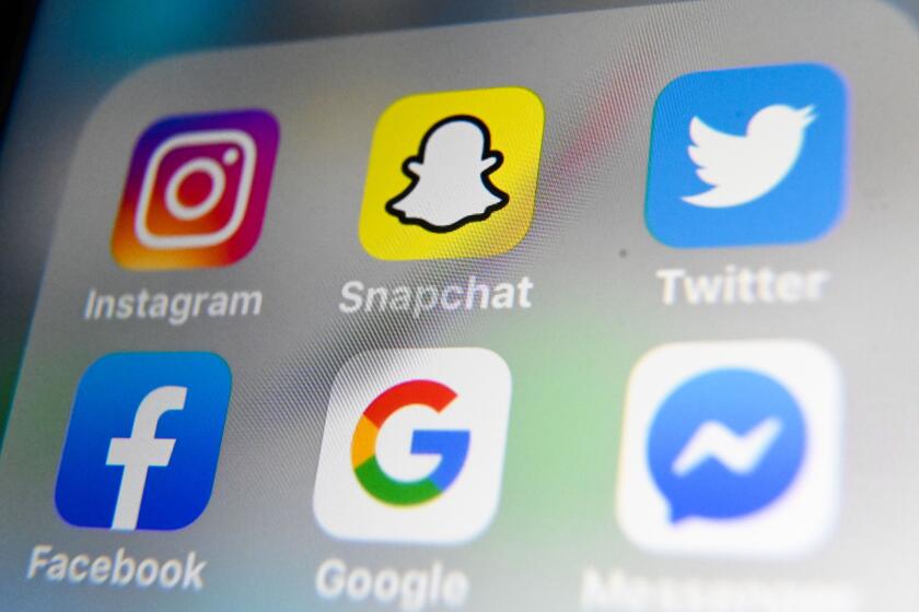 A picture taken on October 1, 2019 in Lille shows the logos of mobile apps Instagram, Snapchat, Twitter, Facebook, Google and Messenger displayed on a tablet. (Photo by DENIS CHARLET / AFP) (Photo by DENIS CHARLET/AFP via Getty Images)