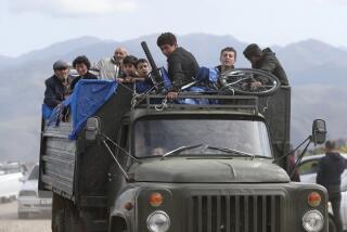 FILE - Ethnic Armenians from Nagorno-Karabakh travel on a truck on their way to Kornidzor, Armenia, on Sept. 26, 2023. Israel has quietly helped fuel Azerbaijan’s campaign to recapture Nagorno-Karabakh, officials and experts say, supplying powerful weapons to Azerbaijan ahead of its lightening offensive last month that brought the Armenian enclave in its territory back under its control.(Stepan Poghosyan, Photolure photo via AP, File)