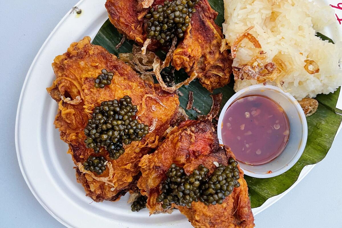 fried chicken with dollops of caviar on top