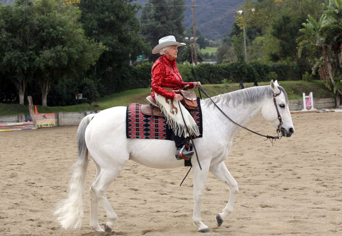 Pat North Ommert rides "Huntin A Hottie" at the Los Angeles Equestrian Center in Burbank, Ca., Wednesday, December 18, 2019. The 90-year-old equestrienne will appear in the 2020 Rose Parade with Horsewomen of Temecula Valley and the Dec. 29 EquestFest.
