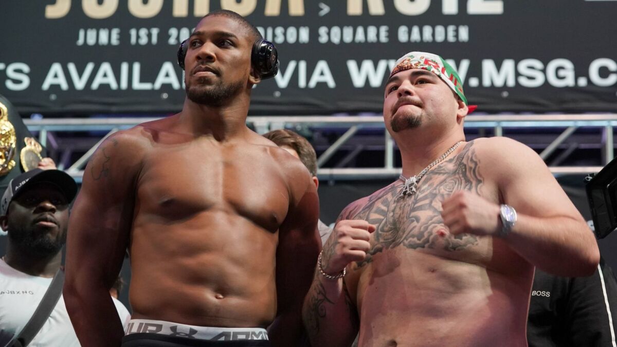 Heavyweight champion Anthony Joshua, left, and Andy Ruiz Jr. are shown during their weigh-in at Madison Square Garden in New York on May 31.