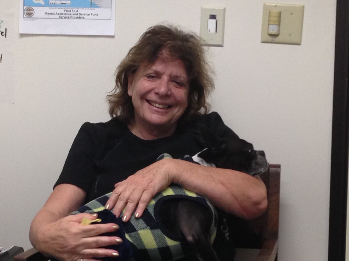 Ruth Schwartz is shown with her dog, Inky.