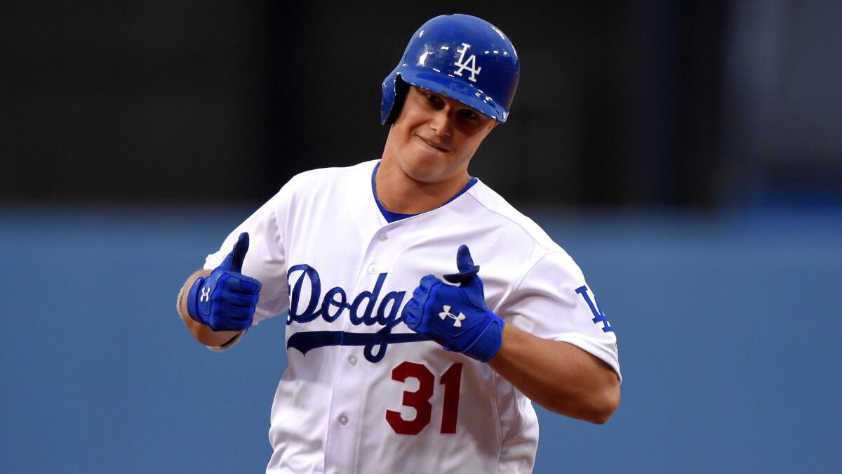 Dodgers center fielder Joc Pederson reacts after hitting a home run against the Padres in the first inning of a game May 23 at Dodger Stadium.