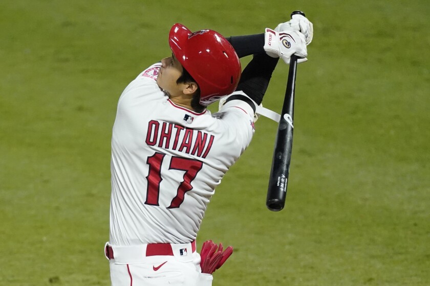 Angels designated hitter Shohei Ohtani takes a swing during a game against the Texas Rangers.