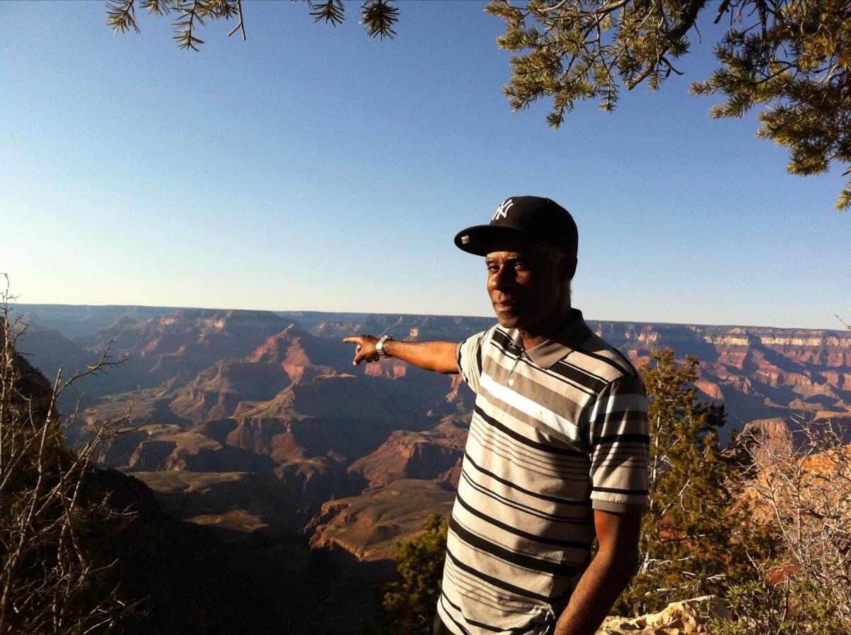 Gary Evans points to the Grand Canyon.