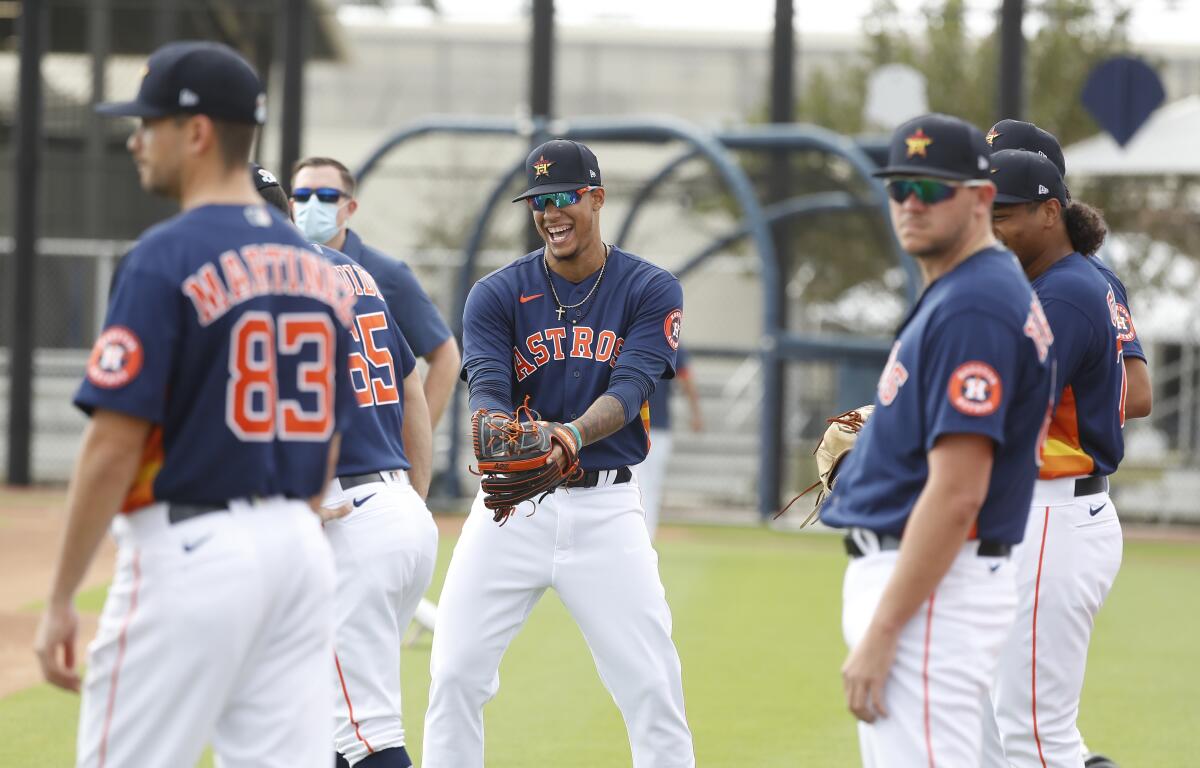 Houston Astros pitcher Bryan Abreu (66) laughs with other pitchers during spring training baseball in West Palm Beach, Fla., Monday, Feb. 22, 2021. (Karen Warren/Houston Chronicle via AP)