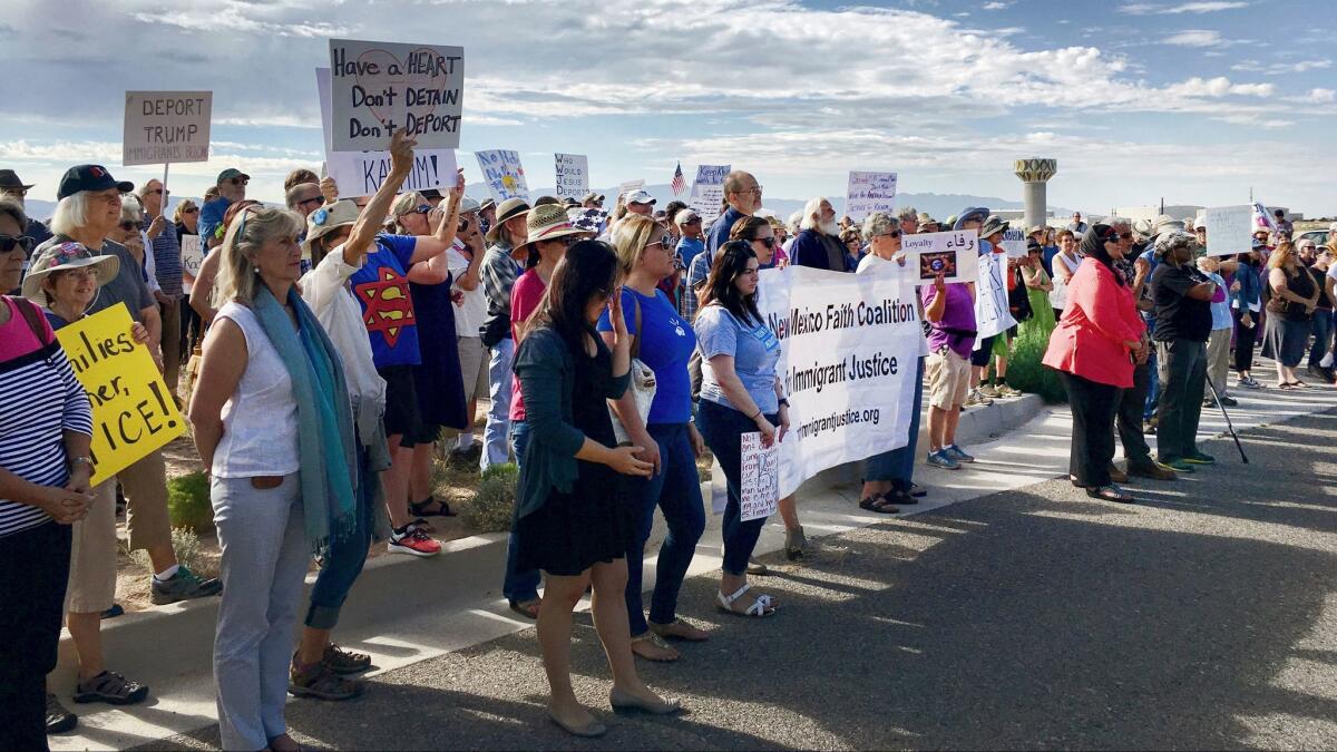 Demonstrators rally in support of Iraqi refugee Kadhim Al-bumohammed outside of Immigration and Customs Enforcement offices in Albuquerque, N.M., on July 13.