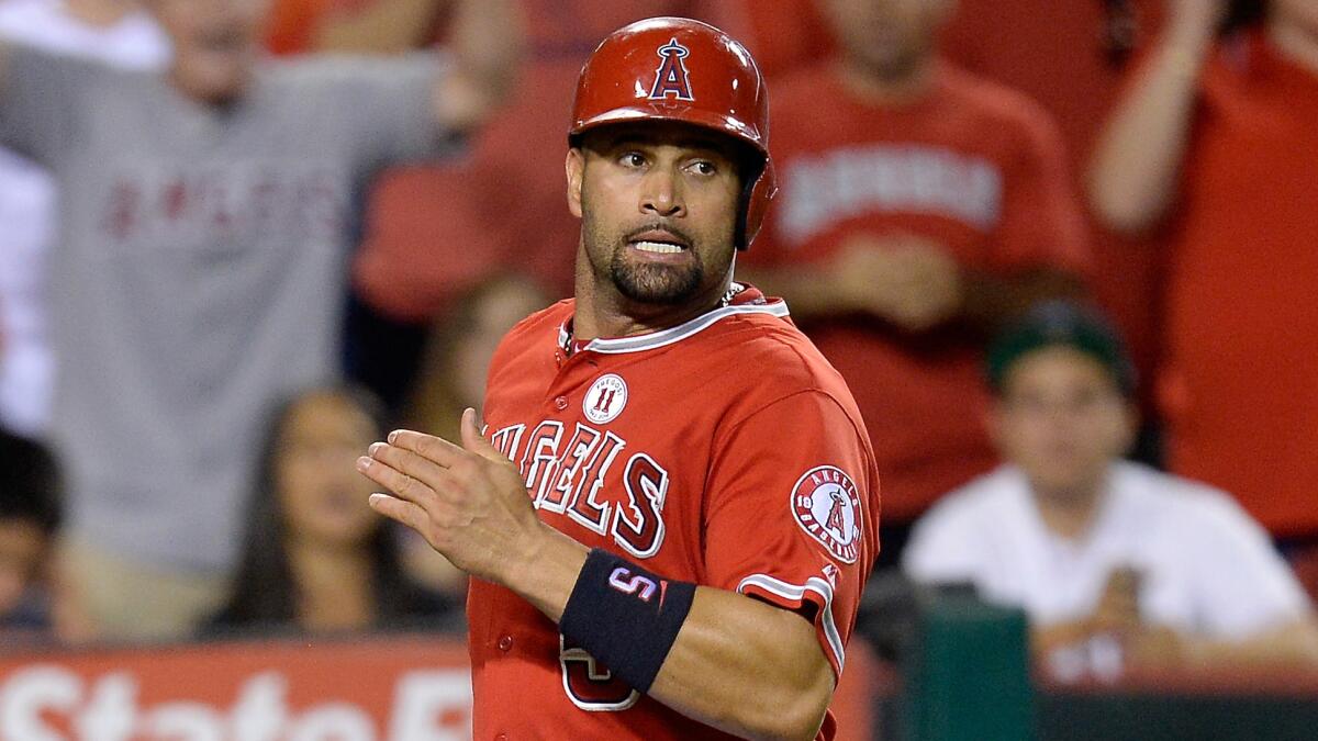 Angels first baseman Albert Pujols scores a run during the sixth inning of the team's 7-2 win over the Philadelphia Phillies on Tuesday.