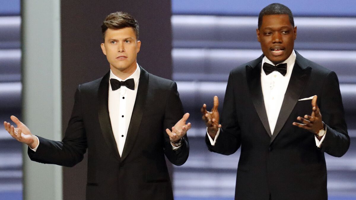 Colin Jost, left, and Michael Che in their opening monologue at the Emmy Awards.