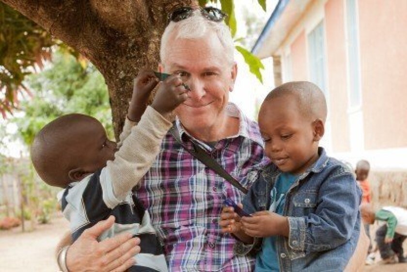 RSF resident and Omo Child co-founder John Rowe with two of the Omo Child kids.
