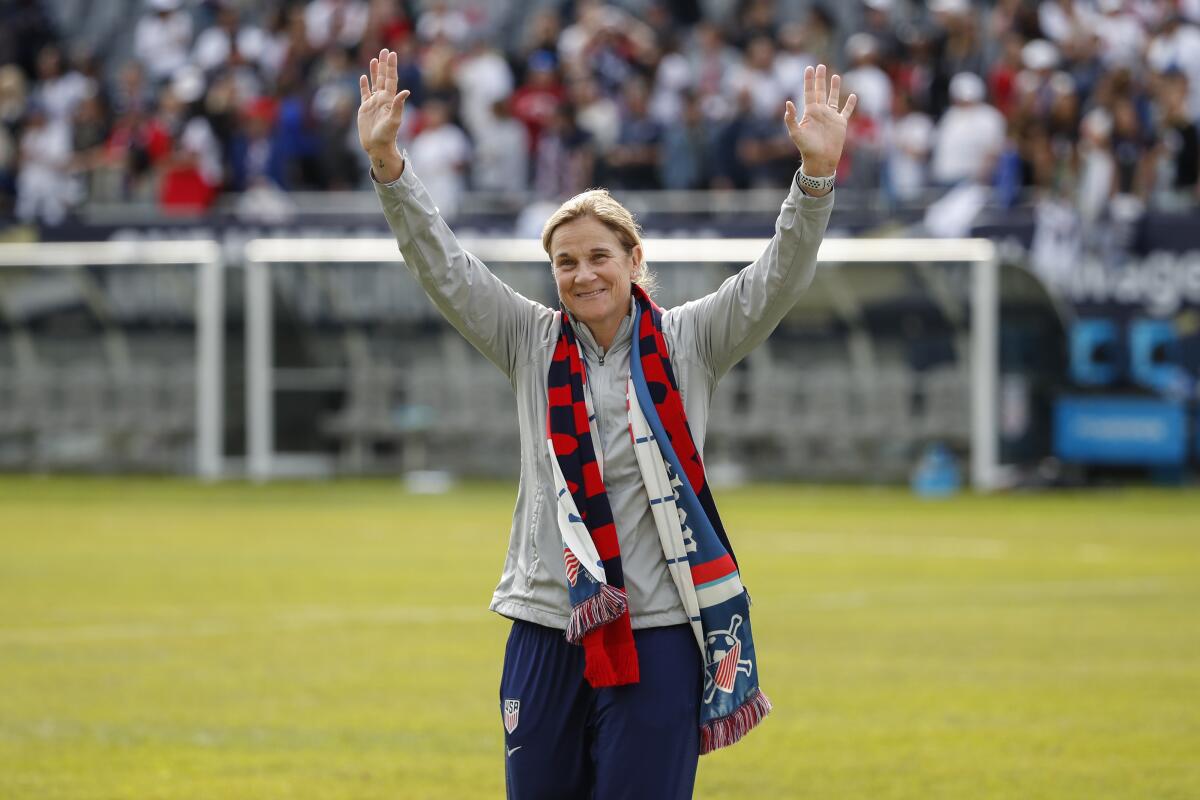 U.S. coach Jill Ellis waves to the crowd as she leaves the field after a match.