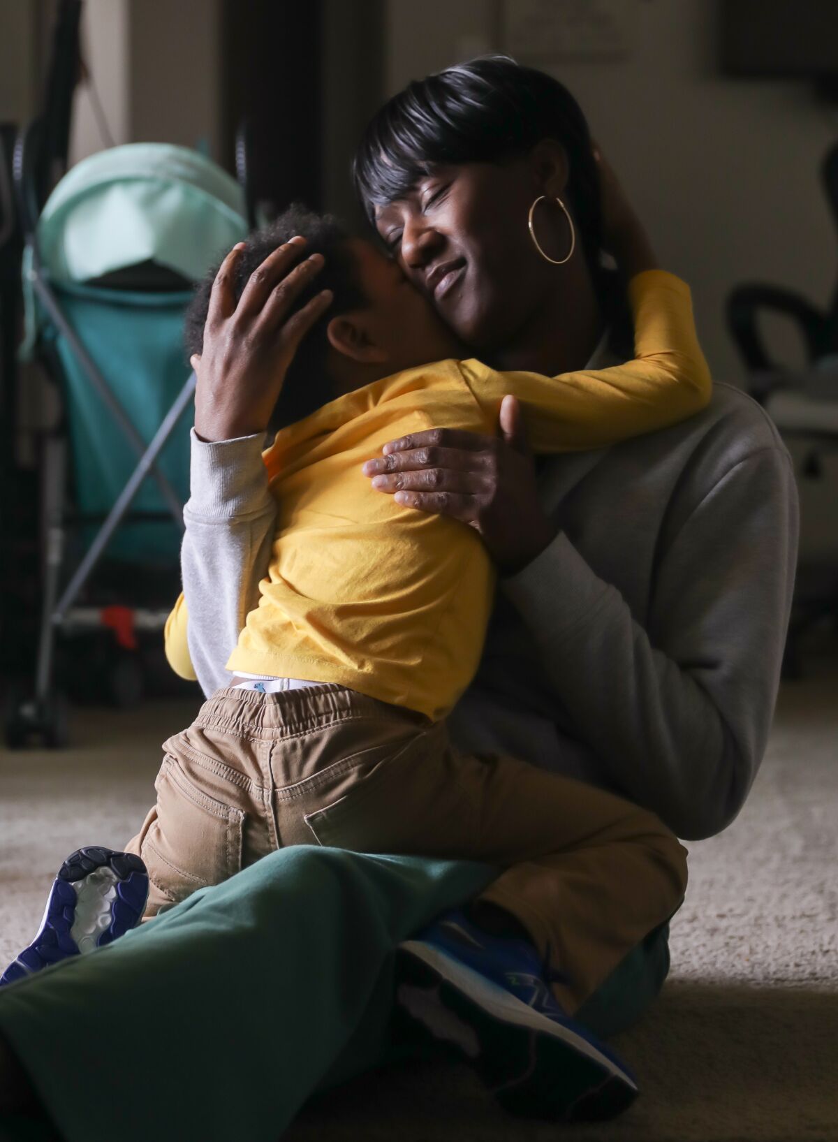 Shaqueta Walker holds her 4-year-old son.