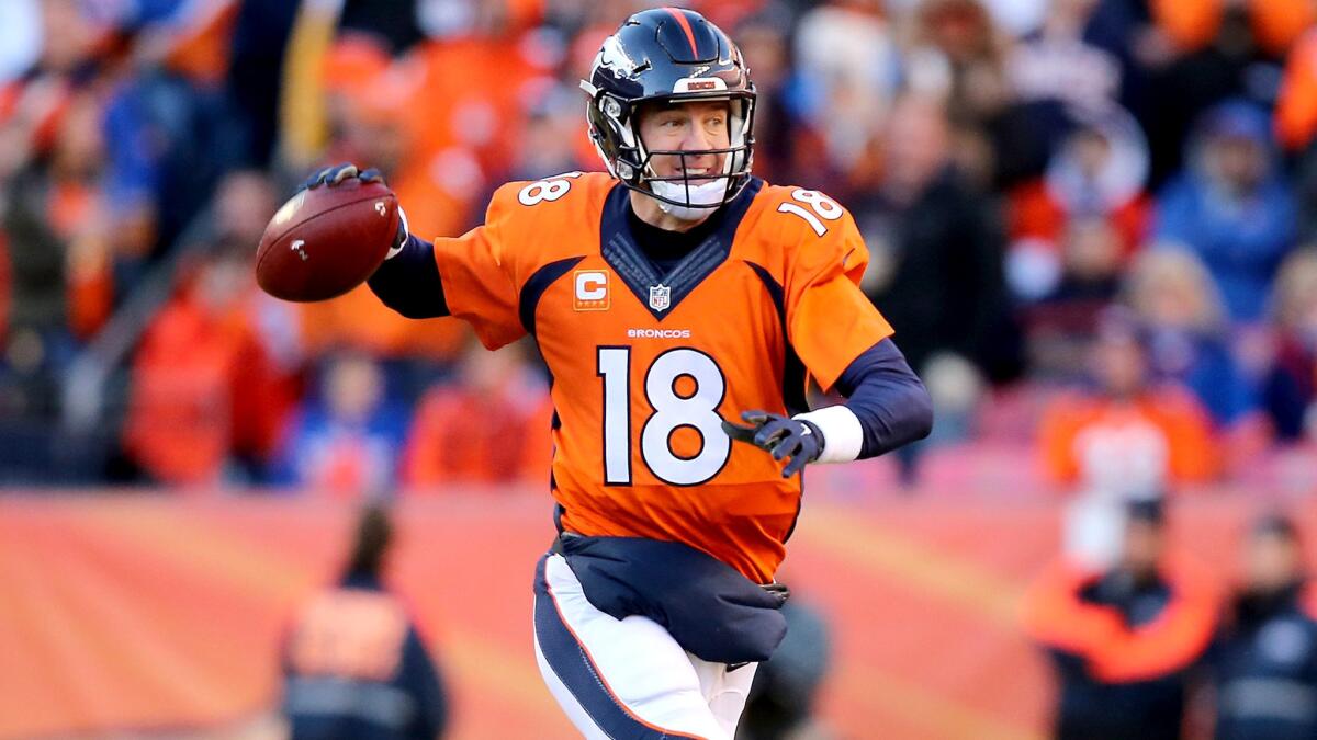 Broncos quarterback Peyton Manning looks to pass against the Steelers while scrambling away from pressure Sunday.