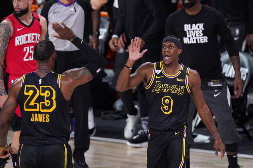 Los Angeles Lakers' Rajon Rondo (9) celebrates with LeBron James (23) after scoring a three-point basket against the Houston Rockets during the first half of an NBA conference semifinal playoff basketball game Sunday, Sept. 6, 2020, in Lake Buena Vista, Fla. (AP Photo/Mark J. Terrill)