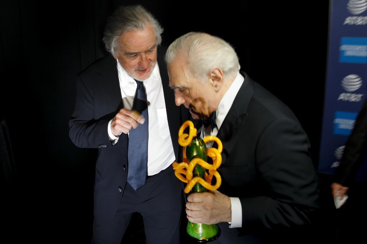 Robert De Niro, left, and director Martin Scorsese, backstage after De Niro presented him with the “Sonny Bono Visionary Award,” for his film “The Irishman,” at the 2020 Palm Springs International Film Festival Film Awards Gala
