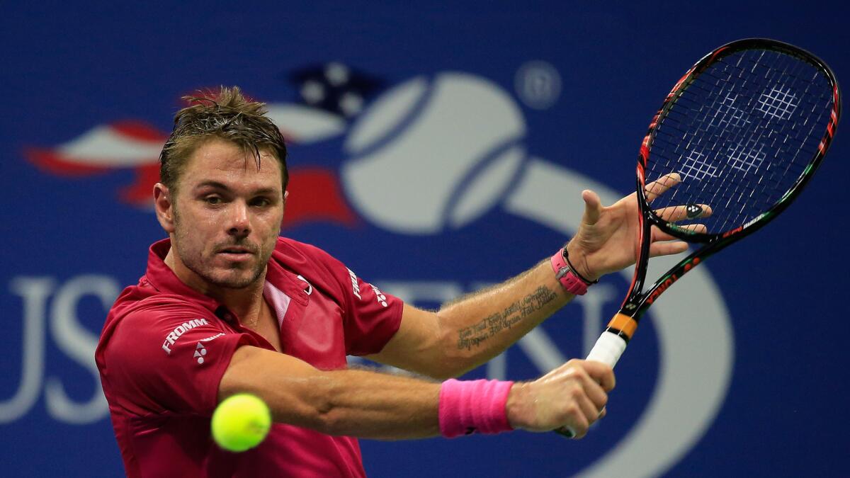 Stan Wawrinka returns a shot against Kei Nishikori during their U.S. Open semifinal match on Friday.