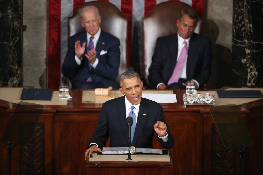 President Obama delivers his State of the Union speech with Vice President Joe Biden, left, and House Speaker John A. Boehner (R-Ohio) looking on Tuesday night.