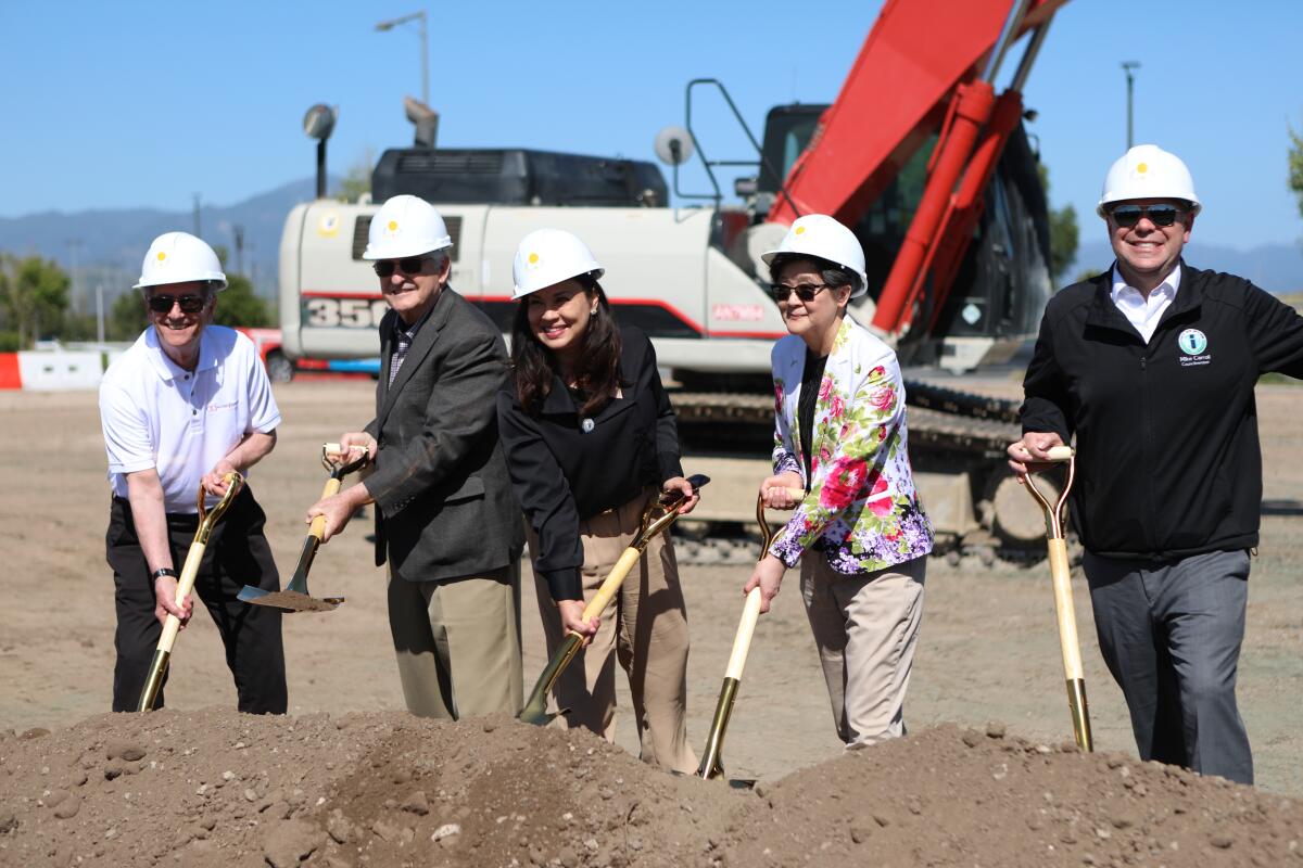 Doug Freeman, Larry Agran, Tammy Kim, Yulan Chung and Mike Carroll with shovels at Irvine’s Great Park.
