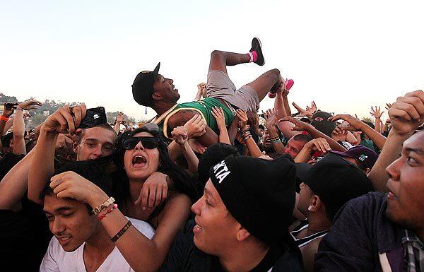 Left Brain, of the Los Angeles hip-hop collective Odd Future Wolf Gang Kill Them All, is moved along by the crowd at the Hard Summer electronic dance music festival on Aug. 6.