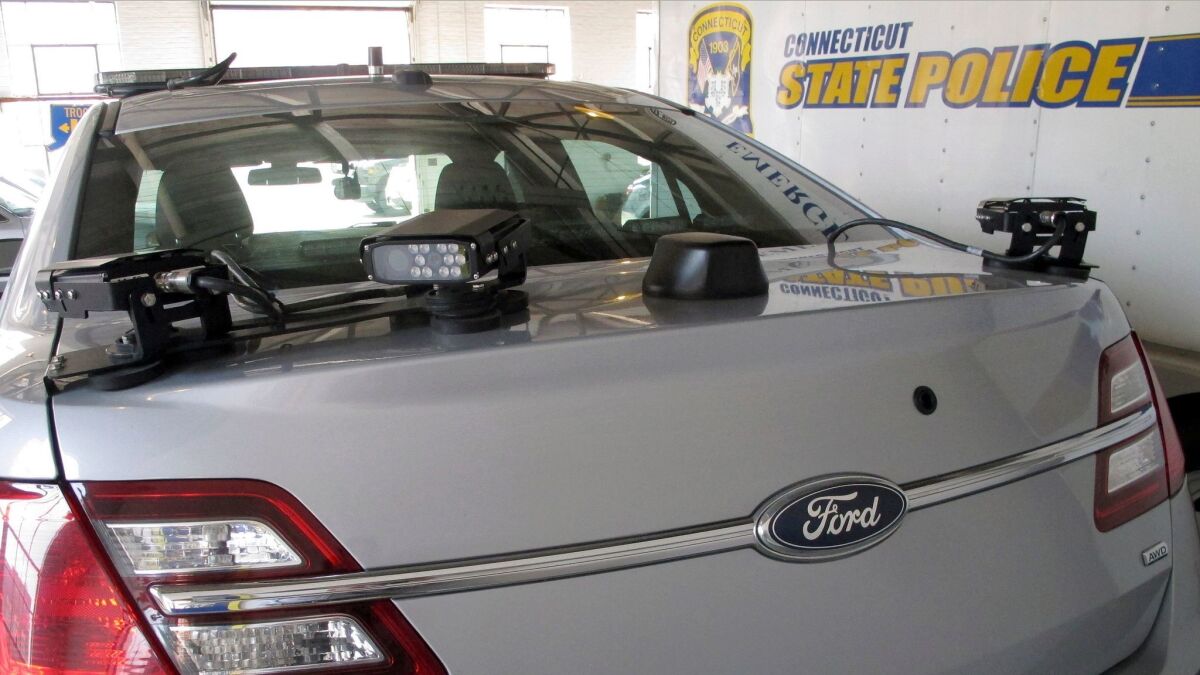 License plate reading cameras are mounted on the back of a Connecticut State Police cruiser in Hartford, Conn. on May 27, 2016.