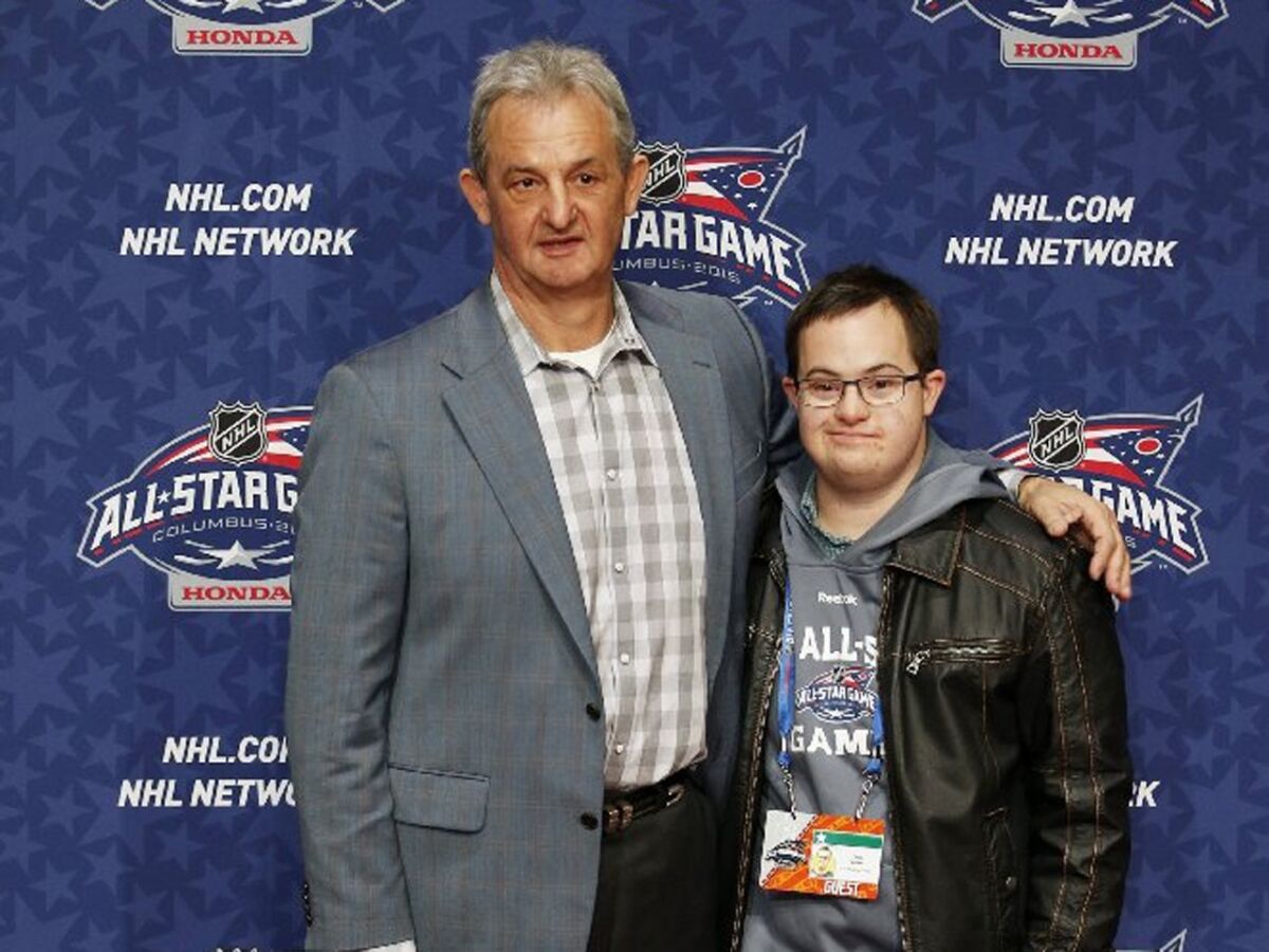 Team Foligno Coach Darryl Sutter of the Kings and his son, Chris Sutter, pose on the NHL All-Star Weekend red carpet in Columbus, Ohio.