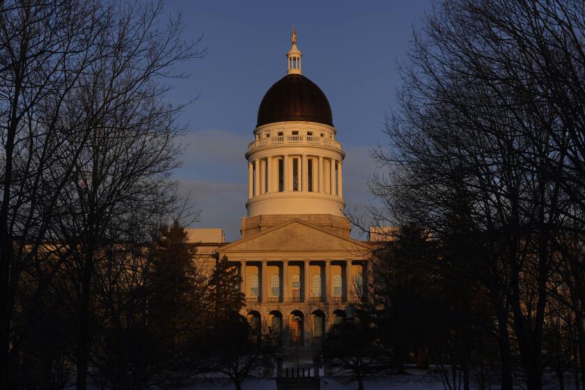 FILE - The Maine State House stands at sunrise, March 16, 2023, in Augusta, Maine. The Maine Legislature moved in fits and starts toward adjournment on Wednesday, April 17, 2024, with unfinished business including final votes on a series of gun safety bills that were introduced after the deadliest shooting in state history last fall. (AP Photo/Robert F. Bukaty, File)