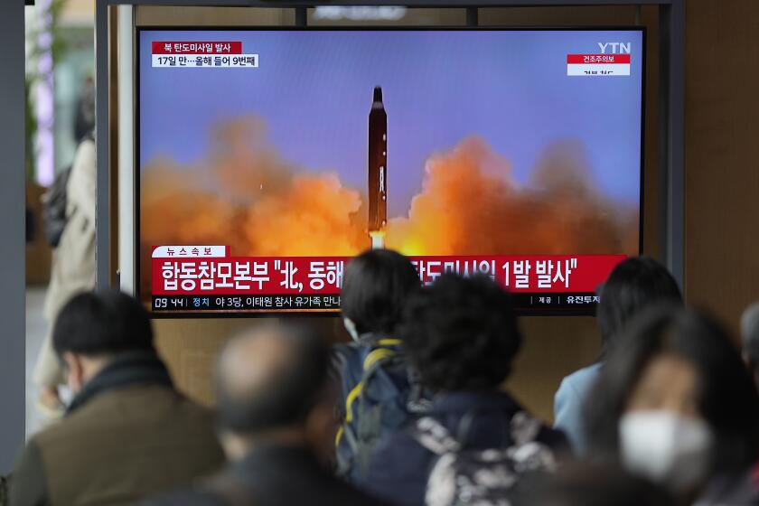A TV screen is seen reporting North Korea's missile launch with file footage during a news program at the Seoul Railway Station in Seoul, South Korea, Thursday, April 13, 2023. North Korea launched a ballistic missile that landed in the waters between the Korean Peninsula and Japan on Thursday, prompting Japan to order residents on an island to take shelter as a precaution. The order has been lifted. (AP Photo/Lee Jin-man)