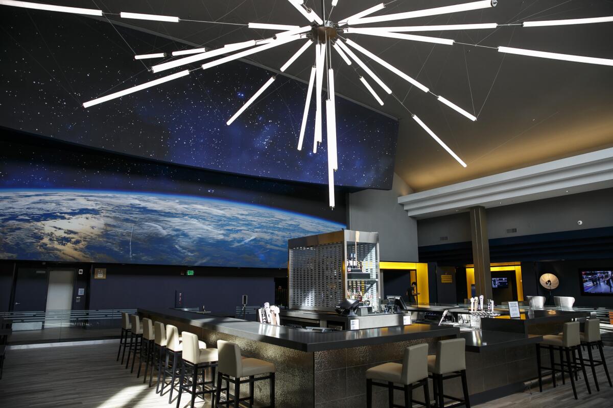 A Space Age bar and a lounging area from a new multimillion-dollar renovation of the Universal CityWalk AMC theater.