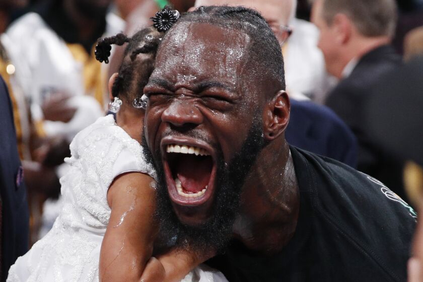 Deontay Wilder celebrates after defeating Luis Ortiz in the WBC heavyweight title boxing match Saturday, Nov. 23, 2019, in Las Vegas. (AP Photo/John Locher)