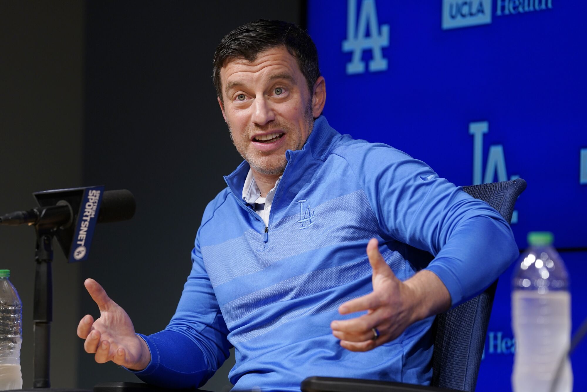 Andrew Friedman, the Dodgers' president of baseball operations, answers questions during a news conference.