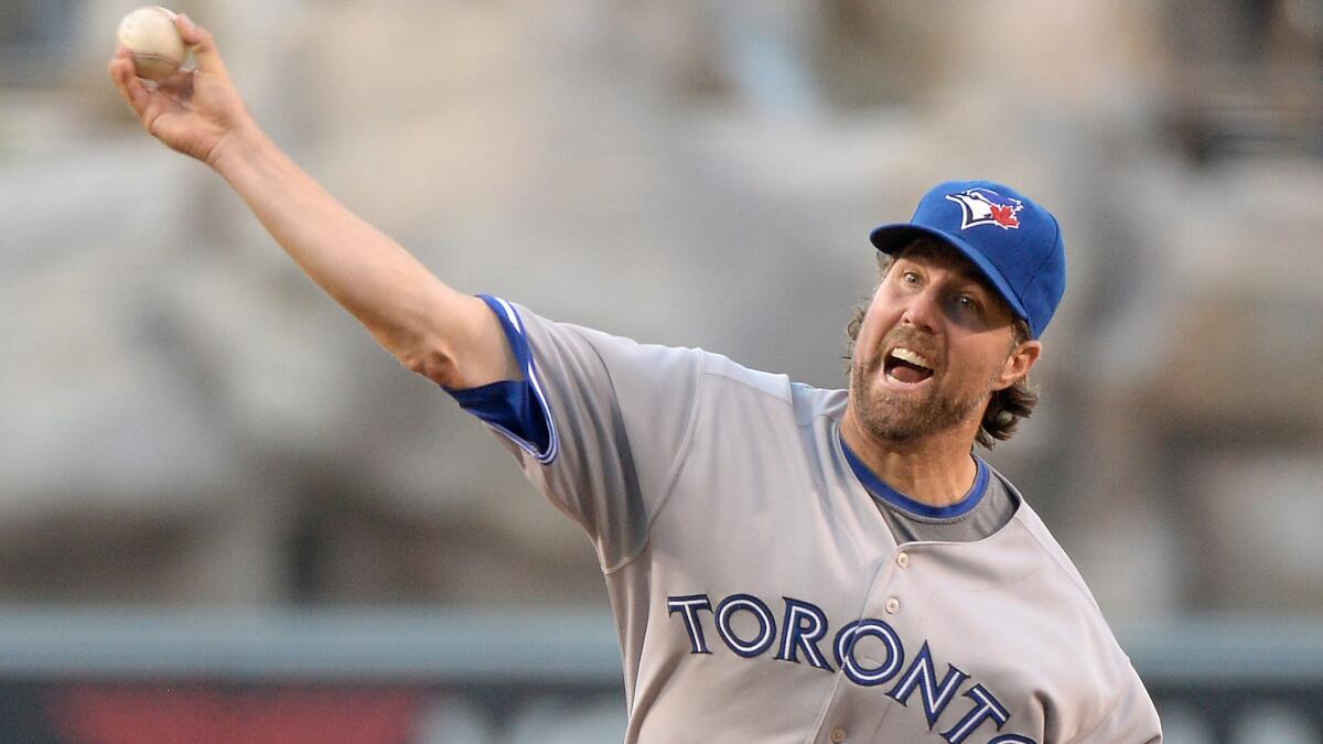 Toronto Blue Jays starter R.A. Dickey allowed four hits and struck out five over seven innings against the Angels to earn his seventh win of the season.