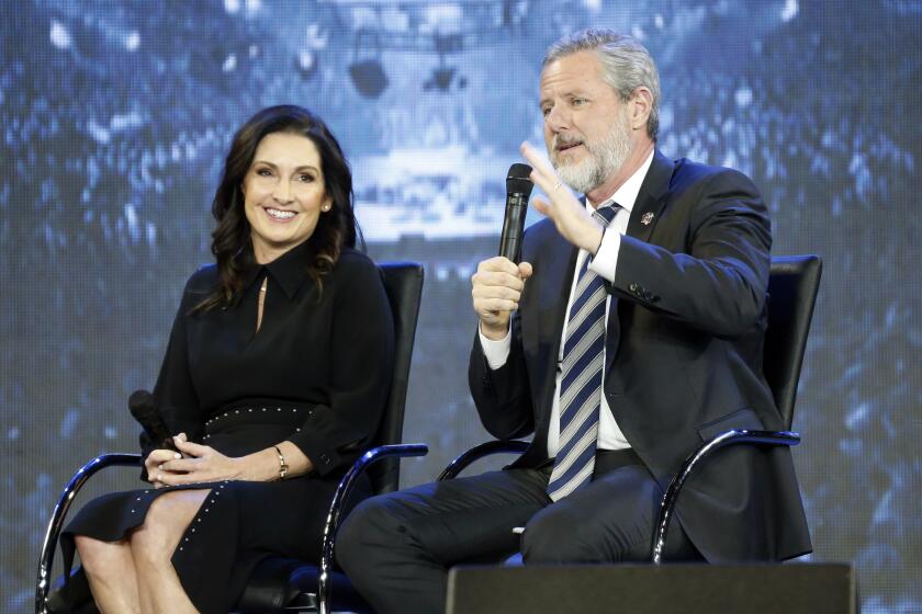 FILE -This Wednesday Nov. 28, 2018 file photo shows Rev. Jerry Falwell Jr., right, and his wife, Becky during after a town hall at a convocation at Liberty University in Lynchburg, Va. Falwell Jr. says he is seeking help for the "emotional toll" from an affair his wife had with a man who he says later threatened his family. (AP Photo/Steve Helber)