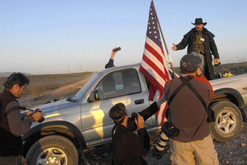 In April 2005, Minuteman volunteer Tim Donnelly speaks to journalists after spending the night monitoring the U.S.-Mexico border near Douglas, Ariz.