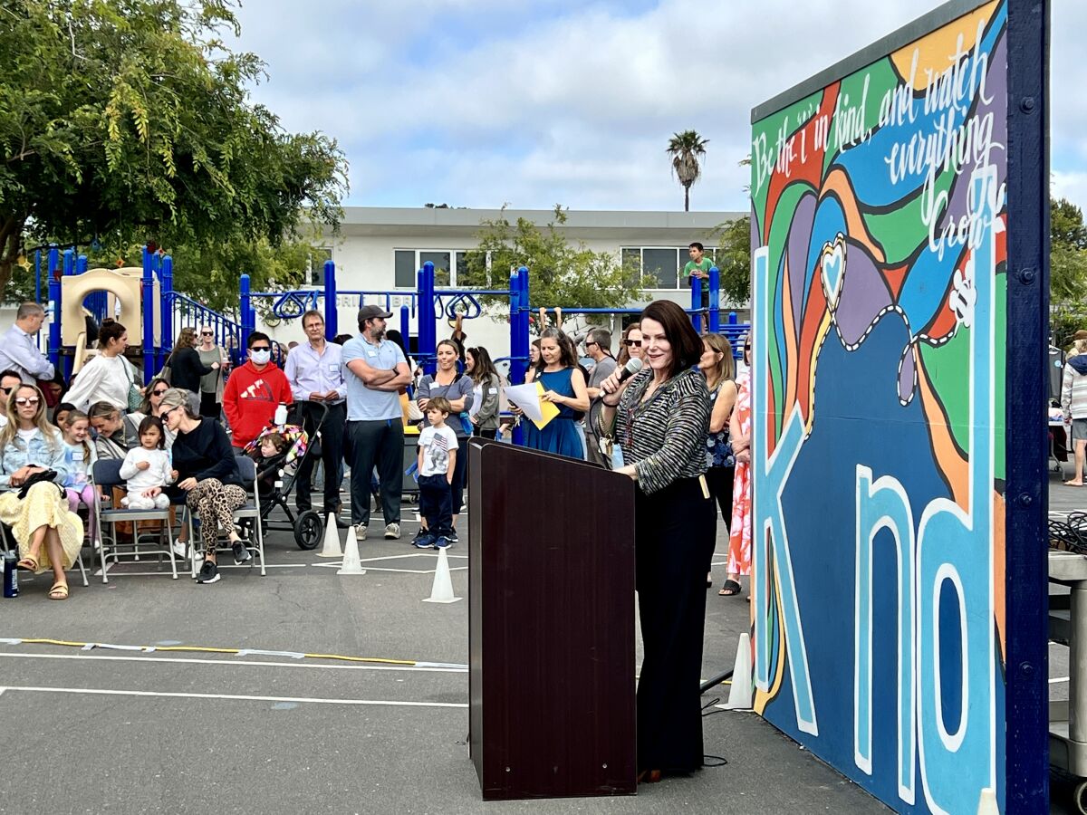 Bird Rock Elementary School Principal Andi Frost welcomes guests to the school's 70th-anniversary party May 26.