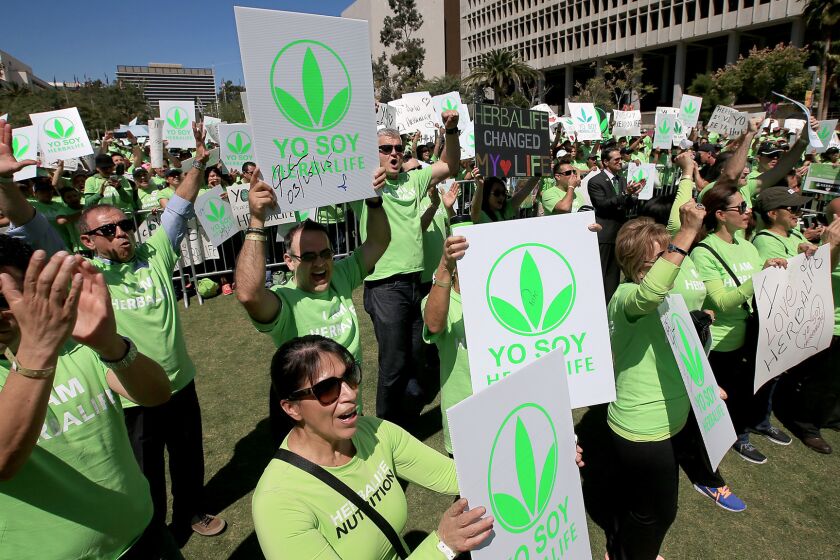 But where are the distributors' mansions? Herbalife got some of the faithful to turn out for a pro-company demonstration in downtown Los Angeles last year.