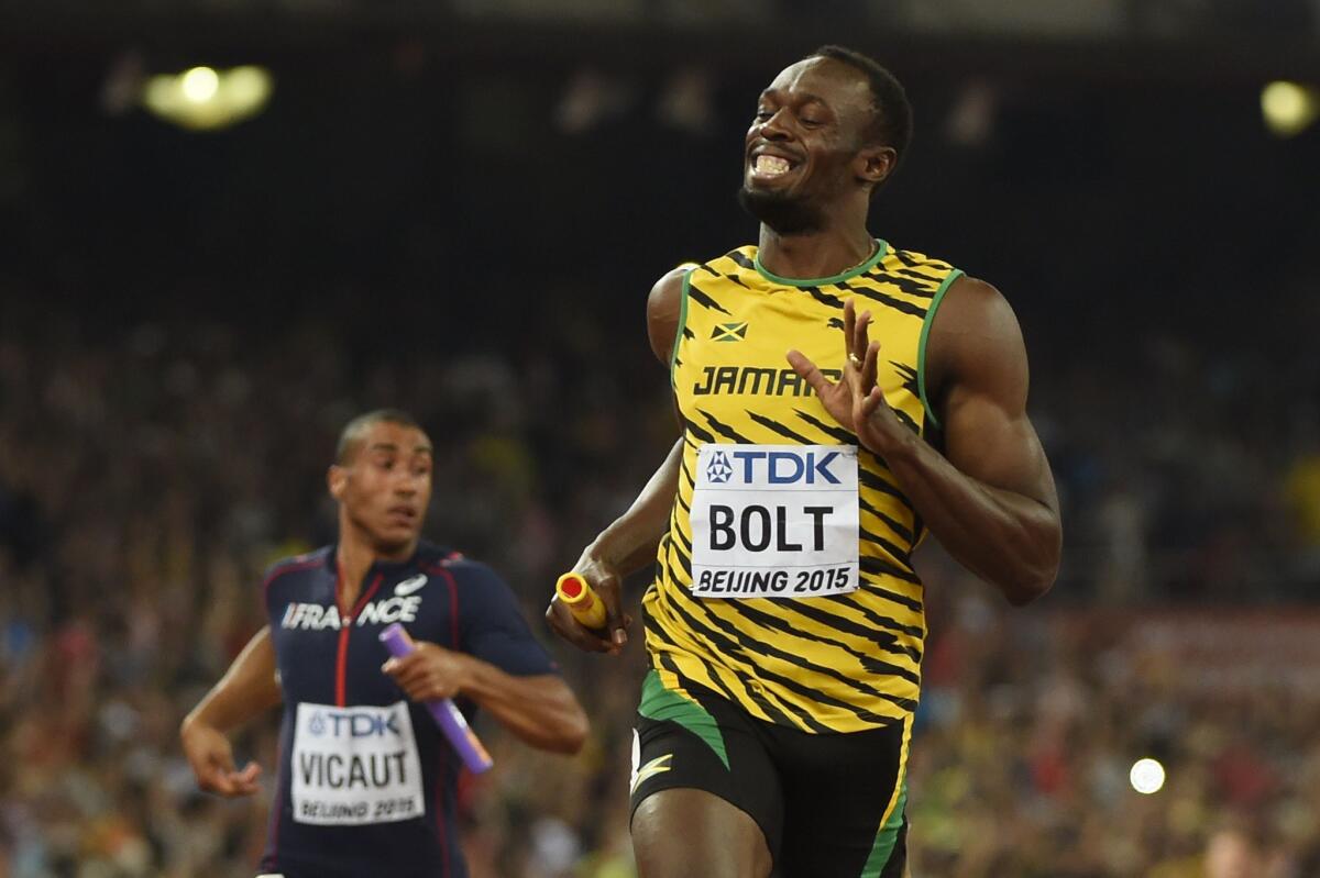 Jamaica's Usain Bolt crosses the finish line ahead of France's Jimmy Vicaut to clinch a victory for Jamaica's 400-meter relay team at the IAAF world championships in Beijing on Aug. 29.