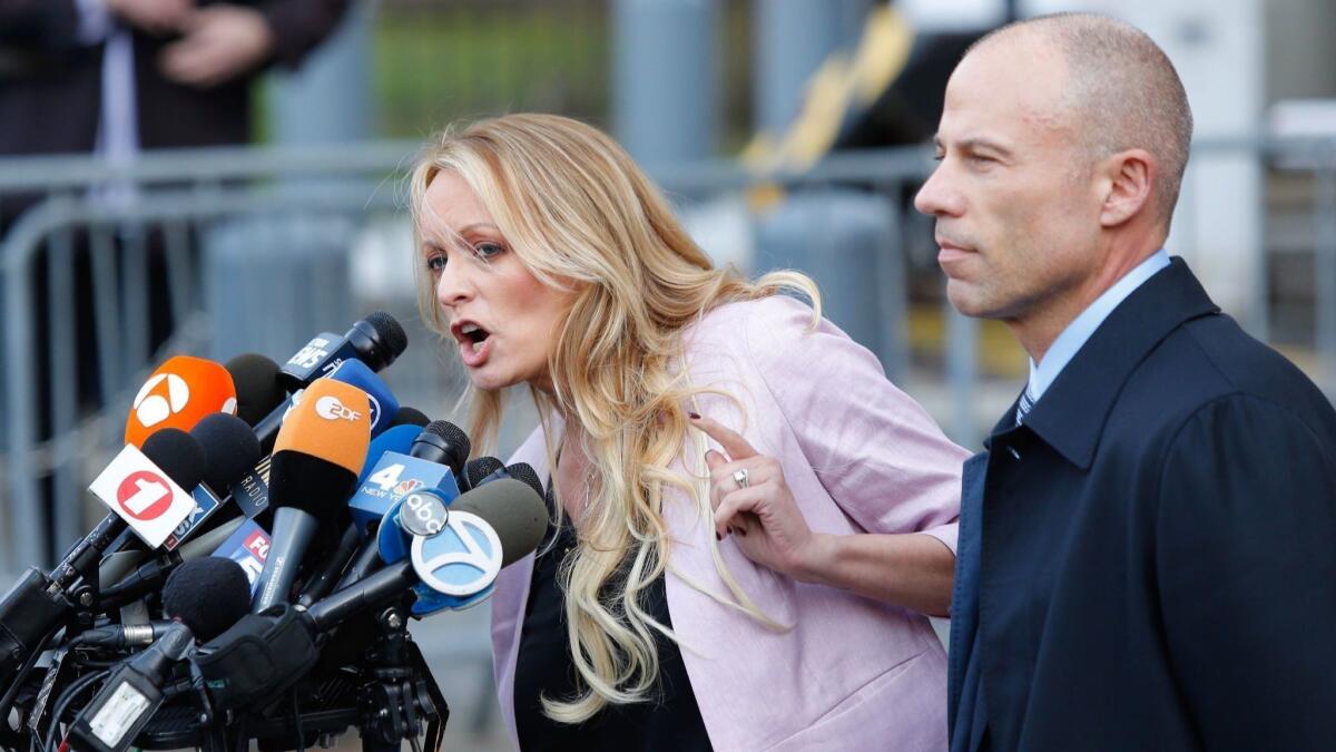 Michael Avenatti, right, with client Stormy Daniels. Avenatti says he will not run for president due to his family's "concerns."
