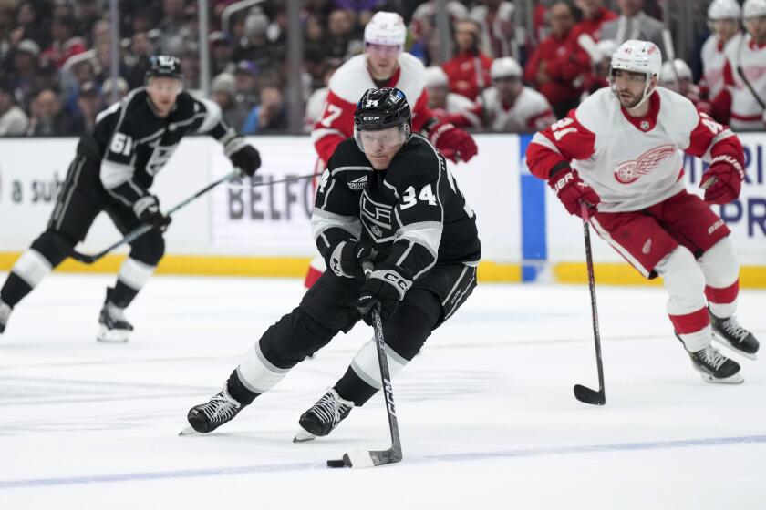 Kings forward Arthur Kaliyev controls the puck against the Detroit Red Wings at Crypto.com Arena.