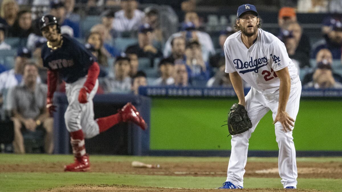 Dodgers pitcher Clayton Kershaw watches after Red Sox right fielder Mookie Betts hits a solo homer 