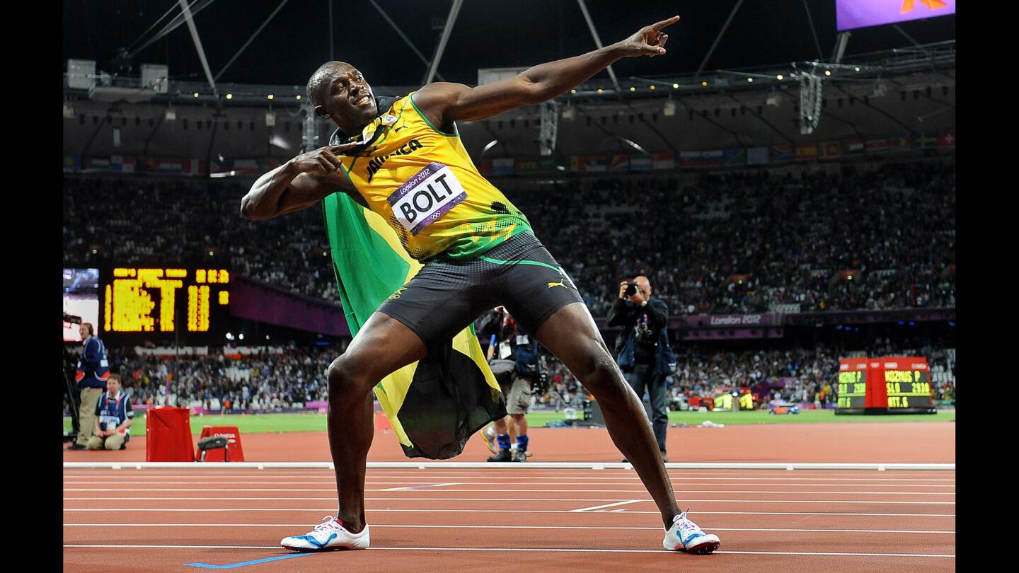 Jamaica's Usain Bolt strikes a pose after winning the gold medal in the 100 meters at the 2012 London Olympics.