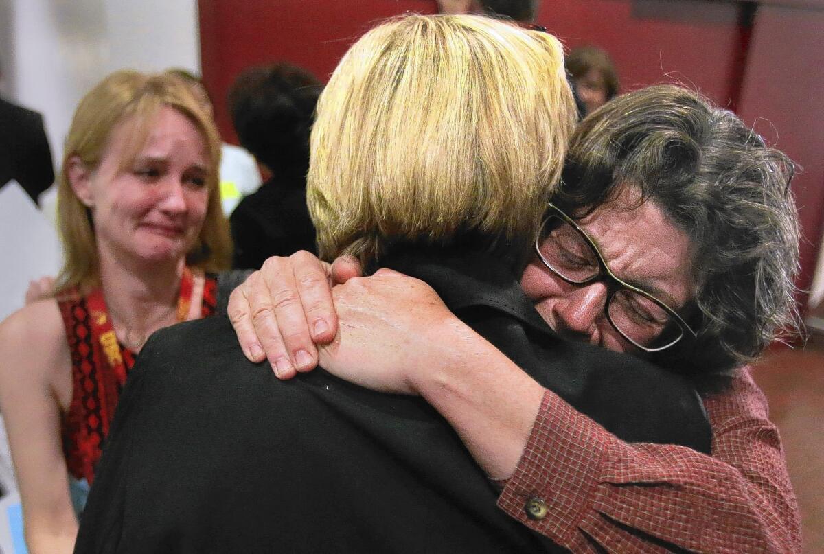 Dr. Luette Forrest, right, sheds tears of joy after the Orange County Board of Supervisors voted in May in favor of implementing Laura's Law, which allows court-ordered treatment of mentally ill adults.