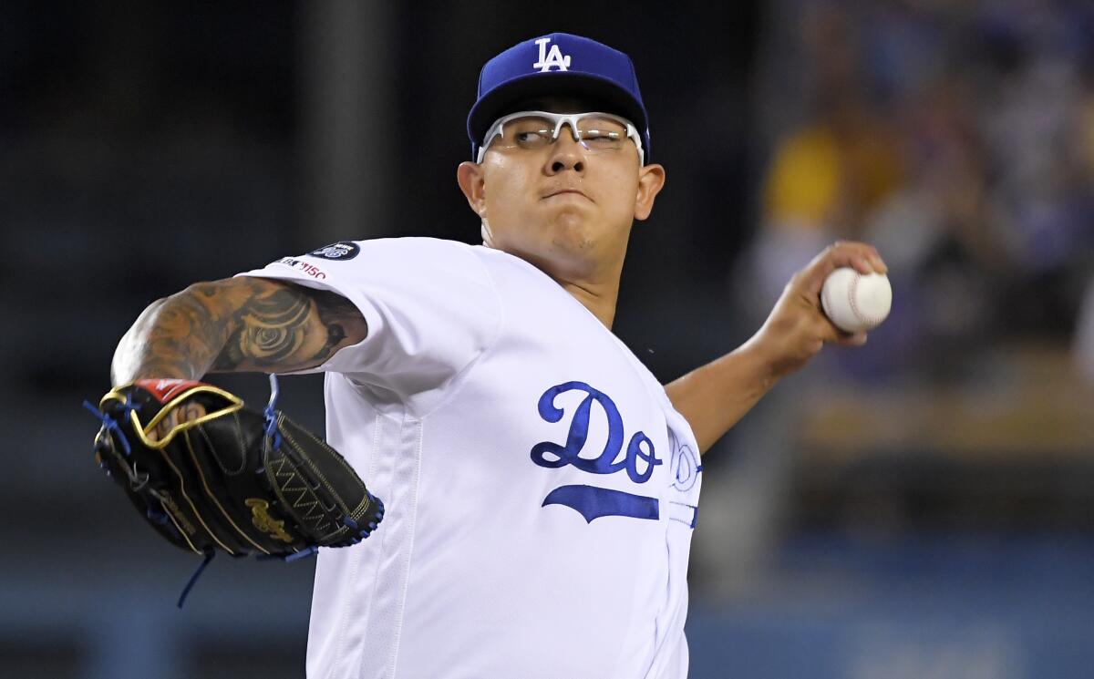 Dodgers starter Julio Urias throws during the second inning of a 5-3 victory over the Colorado Rockies on Tuesday.