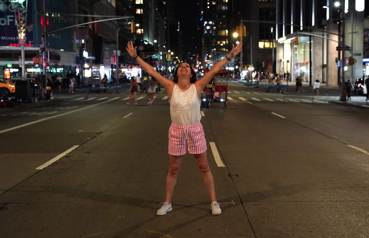 Catalina Soler of Spain celebrates after the lights come back on in Manhattan.
