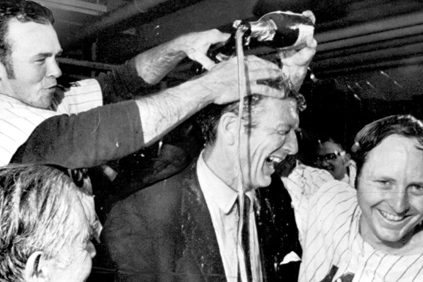 The Mets' Rod Gaspar (right) and Jerry Grote (left celebrate with New York Mayor John Lindsay after clinching the NL pennant in 1969.
