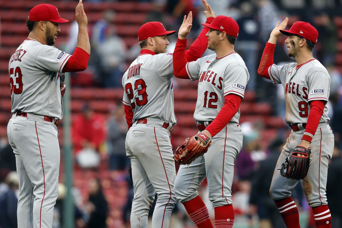 Angels players Carlos Estevez, from left, Brandon Drury, Luis Rengifo and Zach Neto celebrate.