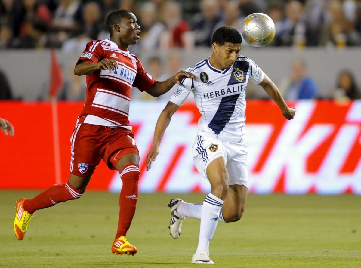 Galaxy defender Sean Franklin, right, tries to keep the ball away from FC Dallas forward Fabian Castillo during a game in 2012. Franklin played six seasons with the Galaxy.