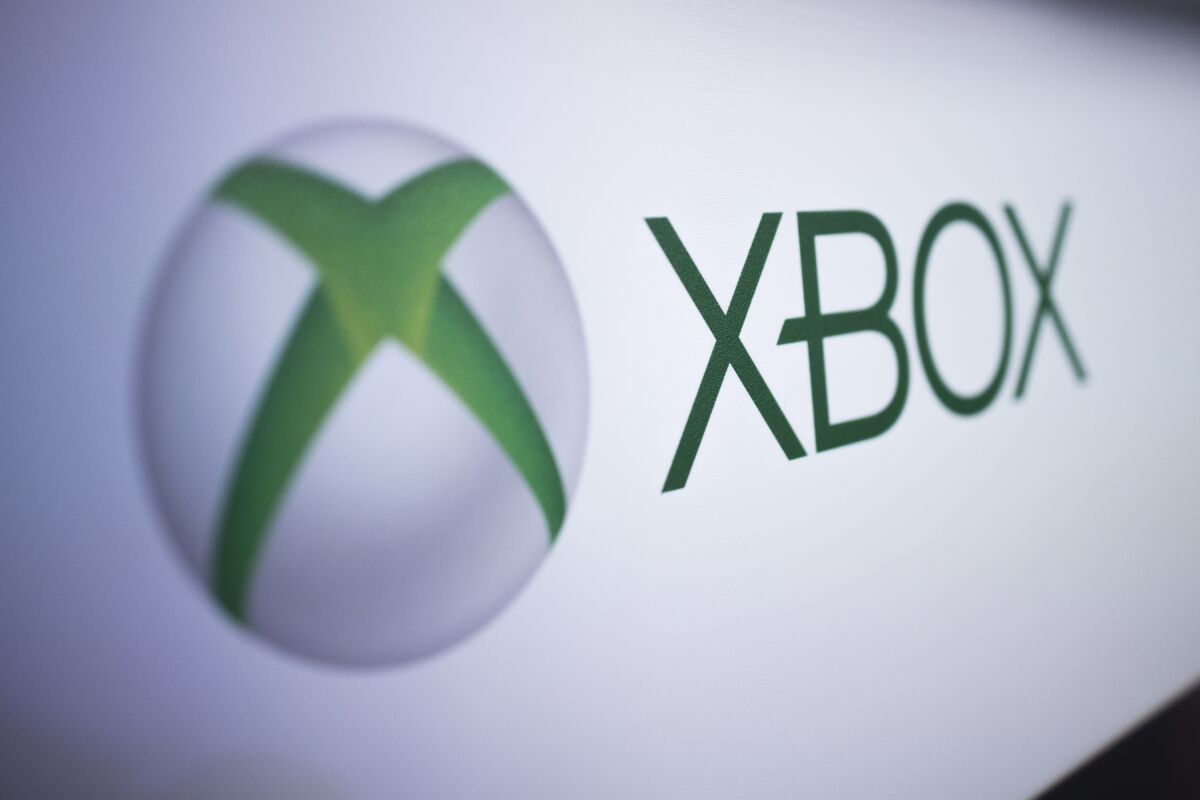 FILE - The Xbox logo is pictured at the Paris Games Week in Paris, Nov. 3, 2017. Microsoft's Xbox video game division on Tuesday, Feb. 21, 2023, announced new partnerships with Nintendo and chipmaker Nvidia as it tries to persuade European regulators to approve its planned $68.7 billion takeover of game publishing giant Activision Blizzard. (AP Photo/Kamil Zihnioglu, File)
